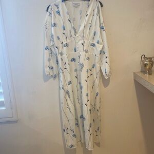 New white dress with long sleeve.